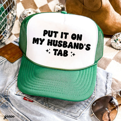 Put It On My Husband's Tab Trucker Hat *12 Colors